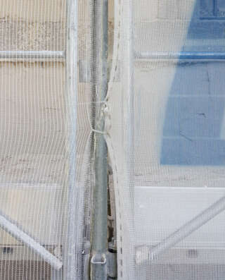 Collier pour filet de protection de façade en situation